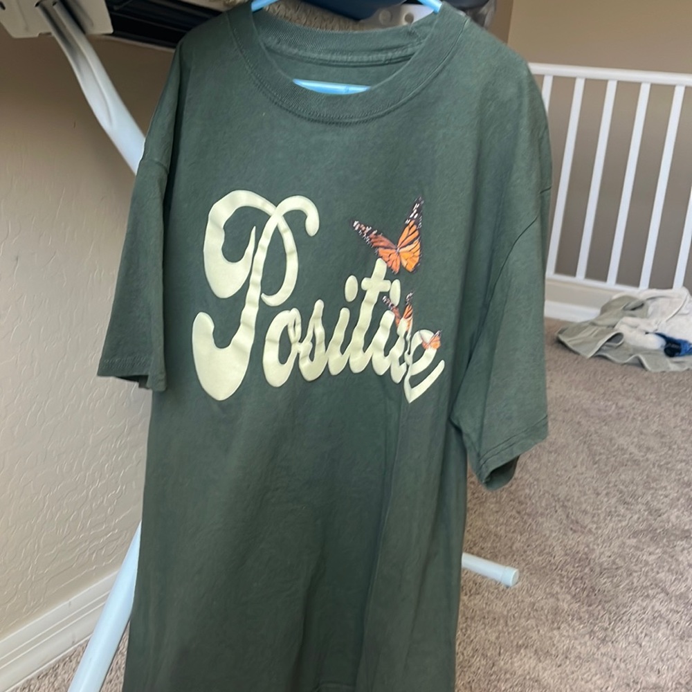 Medium, Green Pacsun shirt. “Positive” With butterflies.